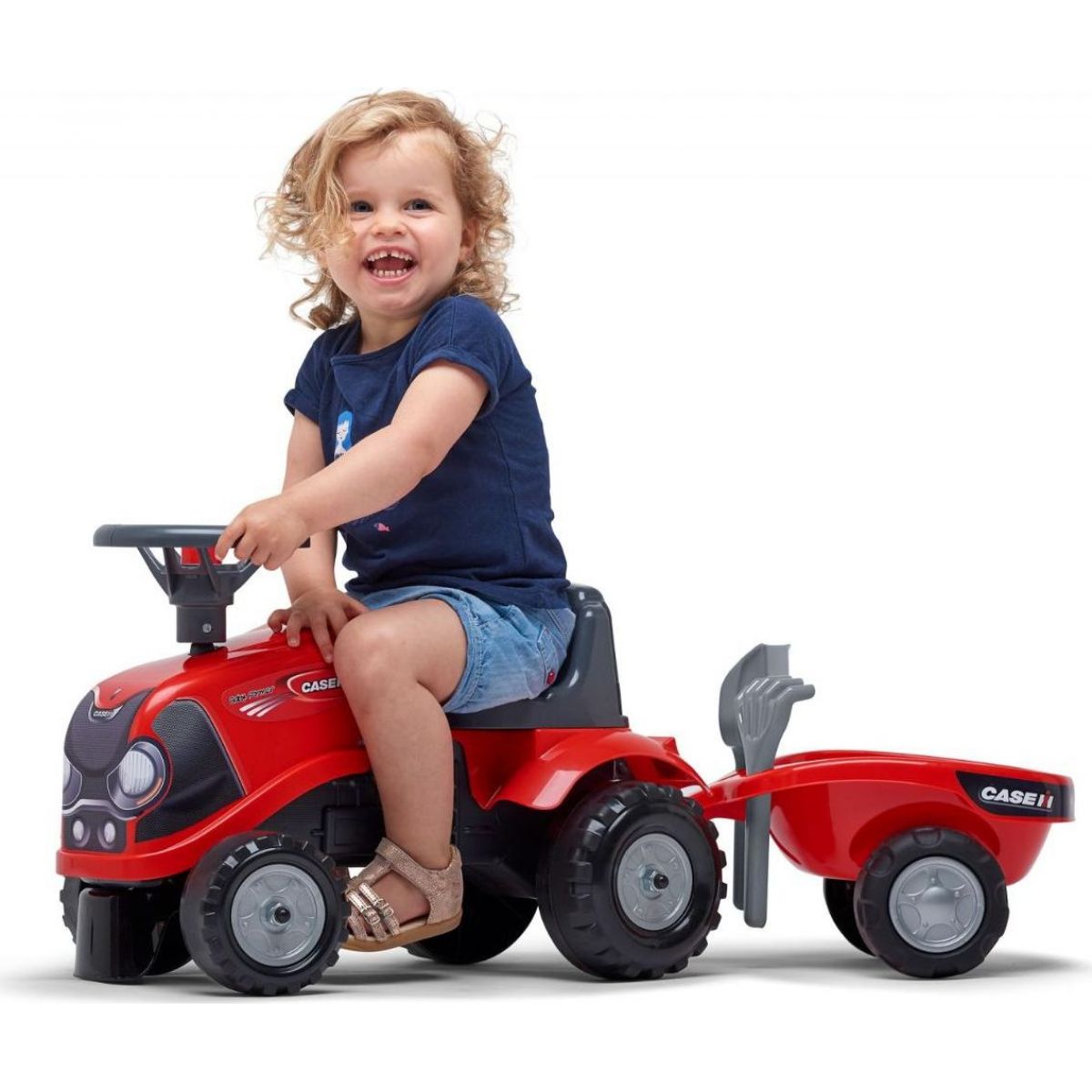 Falk Odstrkovadlo traktor Baby Case IH červený s vlečkou, lopatkou a hrabičkami